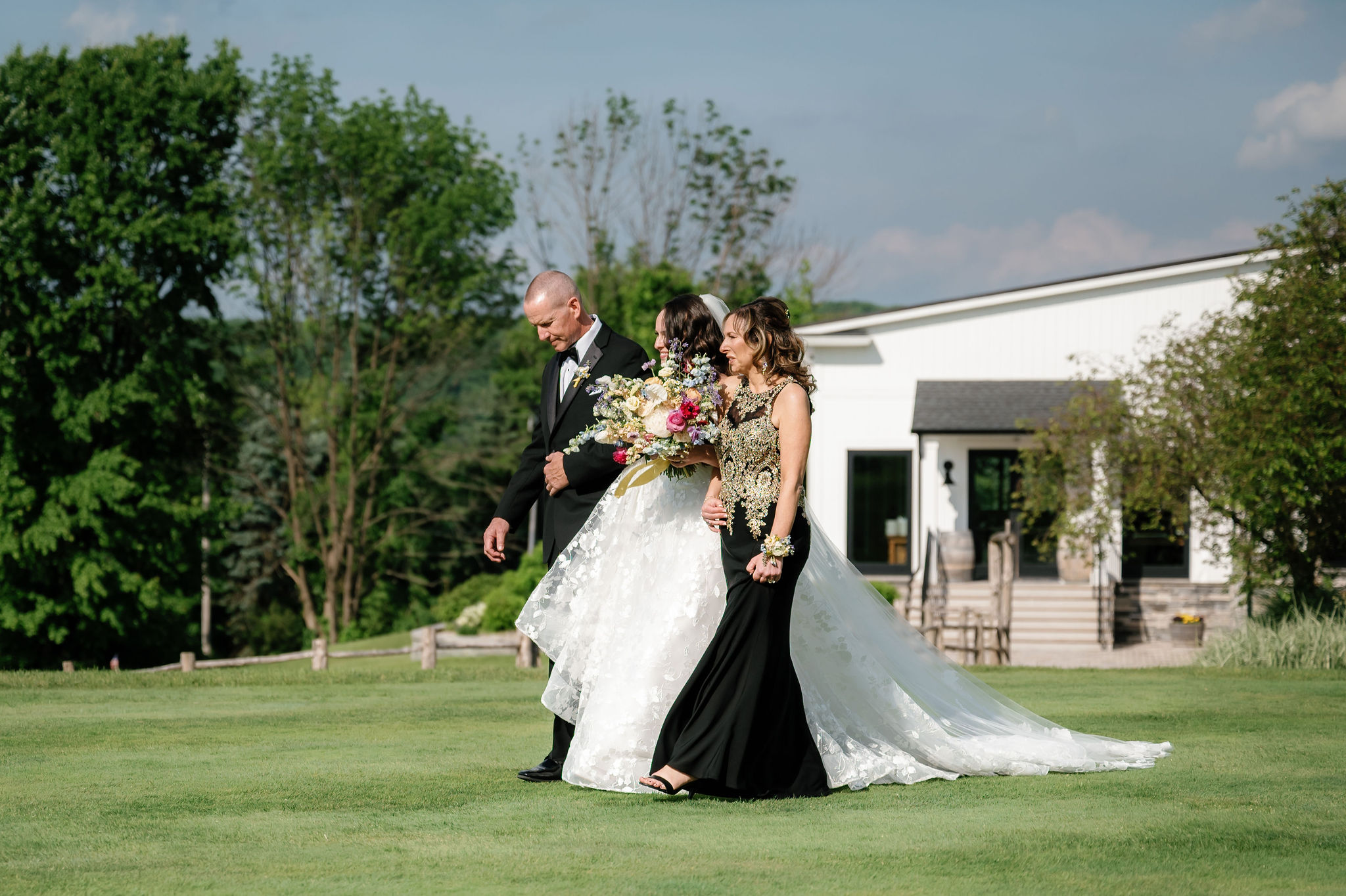 bride walking down aisle by Lisa Blanche Photography